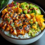 Grilled Maple Sriracha Chicken Bites with Coconut Rice Mango Avocado Salsa Bowl with Chili Mayo